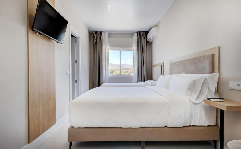 Family Room – Explore Hostal Puerta Almar: Your Oasis for Relaxation and Comfort